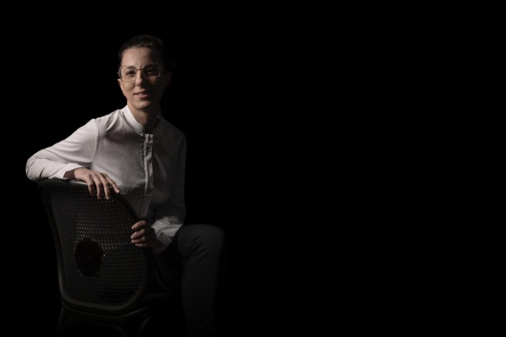 Fierro restaurant chef Carito Lourenço sitting on a chair.